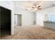 Bright living room with carpet flooring and ceiling fan at 1403 Custer Bayou St, Ruskin, FL 33570