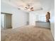 Open living room with carpet flooring and neutral colors at 1403 Custer Bayou St, Ruskin, FL 33570