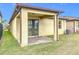 Covered patio with brick pavers and sliding glass door access at 1403 Custer Bayou St, Ruskin, FL 33570