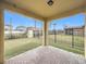 Covered patio provides shaded outdoor space with view of backyard at 1403 Custer Bayou St, Ruskin, FL 33570