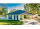 Charming light green house with a newly landscaped lawn and walkway at 2246 Goldenrod St, Sarasota, FL 34239