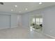 Bright living room with sliding glass doors leading to patio at 2246 Goldenrod St, Sarasota, FL 34239