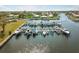 Aerial view of waterfront community with many boat slips at 72 Windsor Dr, Englewood, FL 34223