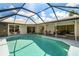 Inviting screened pool with a relaxing patio area at 72 Windsor Dr, Englewood, FL 34223