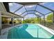 Relaxing screened-in pool with open views at 72 Windsor Dr, Englewood, FL 34223