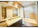 Modern bathroom with double vanity and soaking tub at 814 15Th Ne St, Ruskin, FL 33570