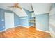 Bright bedroom with built-in shelves and wood flooring at 814 15Th Ne St, Ruskin, FL 33570