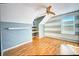 Upstairs bedroom with wood floors and accent wall at 814 15Th Ne St, Ruskin, FL 33570