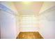 Spacious walk-in closet with ample shelving at 814 15Th Ne St, Ruskin, FL 33570