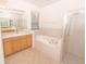 Spacious bathroom with soaking tub, shower, and double vanity at 12908 Cattail Shore Ln, Riverview, FL 33579