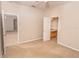 Bedroom with access to shared bathroom and additional living area at 12908 Cattail Shore Ln, Riverview, FL 33579