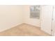 Simple bedroom with window and closet, featuring neutral wall-to-wall carpet at 12908 Cattail Shore Ln, Riverview, FL 33579