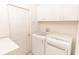 Clean laundry room with washer, dryer, and cabinets at 12908 Cattail Shore Ln, Riverview, FL 33579