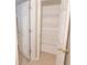 Well-lit storage closet with wire shelving, offering extra storage space at 12908 Cattail Shore Ln, Riverview, FL 33579