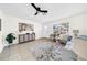 Spacious living room with gray sofa and tiled floors at 5116 Lillilea Ln, New Port Richey, FL 34653