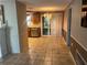 Dining area with chandelier and access to kitchen at 7040 Brentwood Dr, Port Richey, FL 34668