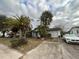 Front view of a ranch home with driveway at 7040 Brentwood Dr, Port Richey, FL 34668