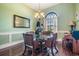 Charming dining room with a glass-top table and wicker chairs at 6437 Alcester Dr, New Port Richey, FL 34655