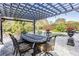 Outdoor dining area with pergola and seating for six, near the pool at 6437 Alcester Dr, New Port Richey, FL 34655