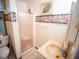 Bathroom with shower stall, sink, and floral border at 38906 North Ave, Zephyrhills, FL 33542