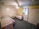 Bedroom with two twin beds, dresser, and ceiling fan at 38906 North Ave, Zephyrhills, FL 33542