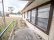 Side view of building showing windows and landscaping at 38906 North Ave, Zephyrhills, FL 33542