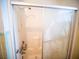 Walk-in shower with sliding glass door at 38906 North Ave, Zephyrhills, FL 33542