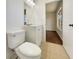 Clean bathroom with white vanity and tile flooring at 3944 Nekoosa St, North Port, FL 34287