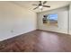 Bedroom with wood-look tile flooring and large window at 3944 Nekoosa St, North Port, FL 34287