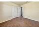 Bedroom with wood-look tile flooring and large closet at 3944 Nekoosa St, North Port, FL 34287