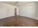 Well-lit bedroom with hardwood floors and a spacious closet at 3944 Nekoosa St, North Port, FL 34287