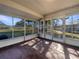 Enclosed patio with tile flooring and screened windows at 3944 Nekoosa St, North Port, FL 34287