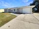 House exterior featuring a single-car garage and landscaped yard at 3944 Nekoosa St, North Port, FL 34287