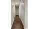 Long hallway with tile flooring and built-in storage at 3944 Nekoosa St, North Port, FL 34287