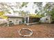 Backyard view with screen porch and storage shed at 4137 Glissade Dr, New Port Richey, FL 34652