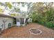 Backyard view with screen porch and storage shed at 4137 Glissade Dr, New Port Richey, FL 34652