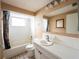 Bathroom with shower/tub combo and vanity at 4137 Glissade Dr, New Port Richey, FL 34652