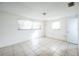 Simple bedroom with tile floors and two windows at 4137 Glissade Dr, New Port Richey, FL 34652