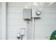 Exterior view of electrical meter and panel at 4137 Glissade Dr, New Port Richey, FL 34652