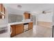 View of kitchen with dining area and sliding door at 4137 Glissade Dr, New Port Richey, FL 34652