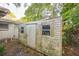 View of a rustic storage shed in the backyard at 4137 Glissade Dr, New Port Richey, FL 34652