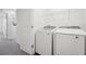 Bright laundry room, features washer and dryer at 6188 Pina Colada St, Zephyrhills, FL 33542