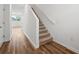 Bright entryway with carpeted staircase and wood-look flooring at 6188 Pina Colada St, Zephyrhills, FL 33542