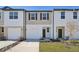 Two-story townhome with attached garage and front yard at 6188 Pina Colada St, Zephyrhills, FL 33542