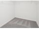 Walk-in closet with grey carpet and wire shelving at 6215 Pina Colada St, Zephyrhills, FL 33542