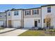 Two-story townhouse with attached garage and front yard at 6215 Pina Colada St, Zephyrhills, FL 33542