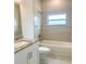 Clean bathroom with tub, shower, and granite countertop at 1379 Prairie Ter, North Port, FL 34286