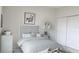 Bright bedroom with gray bedding and double doors at 1379 Prairie Ter, North Port, FL 34286