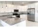 Modern kitchen with stainless steel appliances and granite countertops at 1379 Prairie Ter, North Port, FL 34286