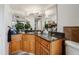 Bathroom with granite countertop and wood cabinets at 2333 Feather Sound Dr # A101, Clearwater, FL 33762